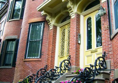 Entrance of red brick town house in Boston, MA