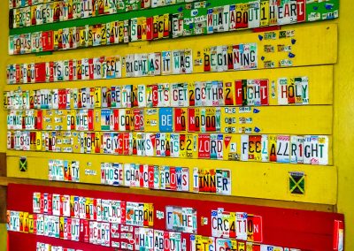 Lyrics of One Love made out of license plates at Tuff Gong International, Kingston