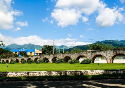 Aqueduct and bookshop at UWI and Blue Mountains in background, Jamaica