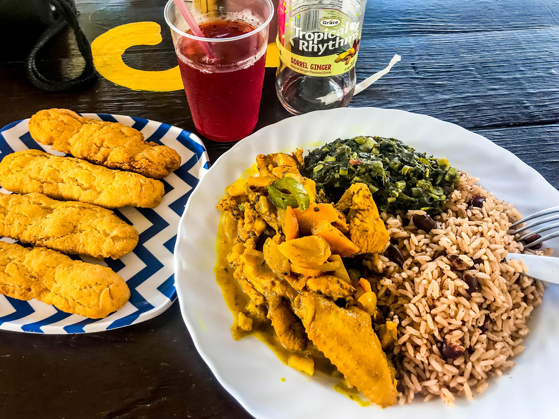 Jamaican food festival, curried chicken, rice and peas, callaloo in Negril, West End