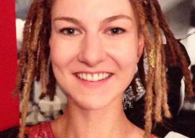 Blonde girl with short dreadlocks shortly after being locked
