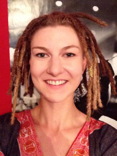 Blonde girl with short dreadlocks shortly after being locked