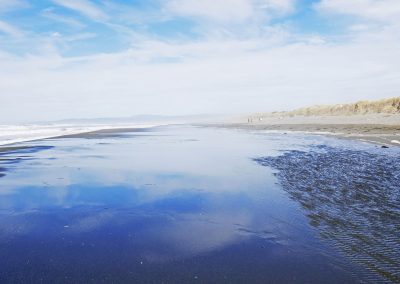 Clouds reflecting in the water at Samoa Beach, Humboldt County, CA