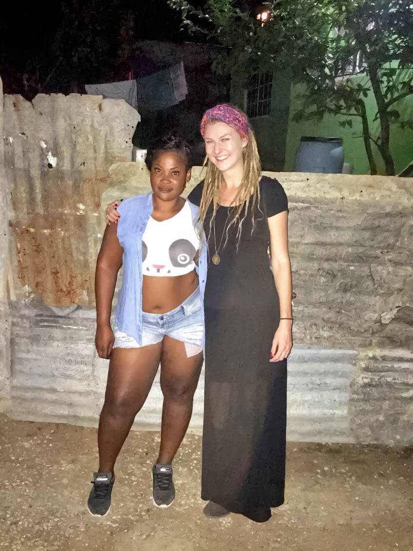 Jamaican girl and German rasta girl in neighborhood in Montego Bay, Jamaica