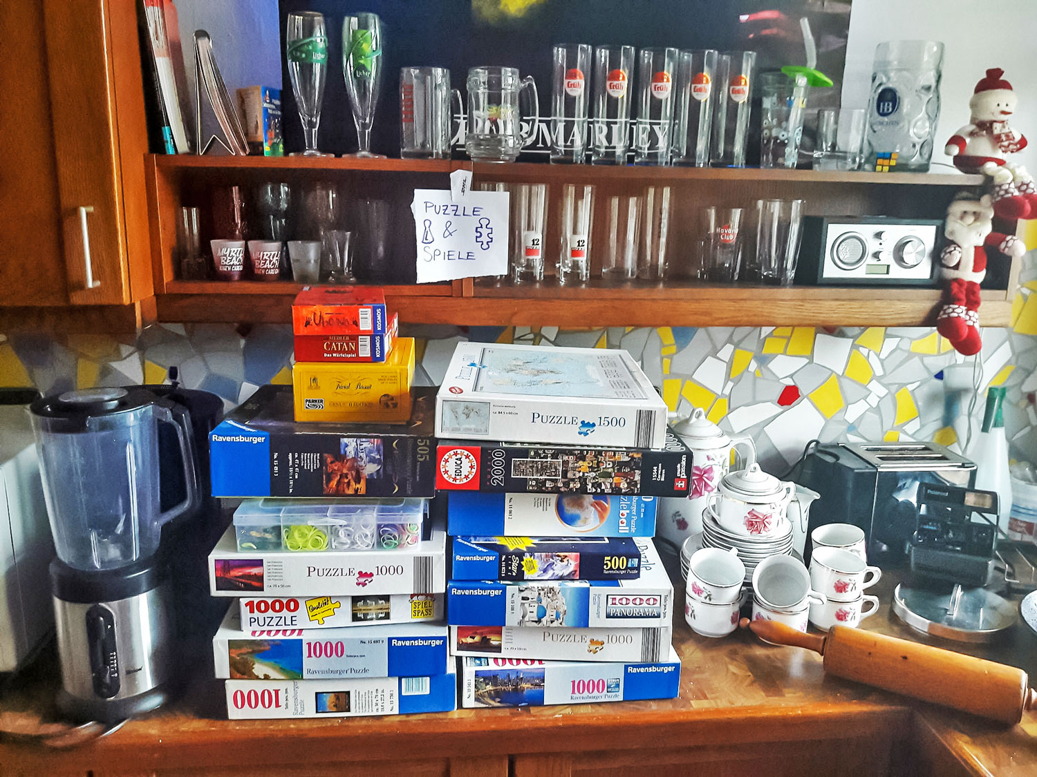 Glasses, games and other household goods for sale in kitchen in Cologne, Germany