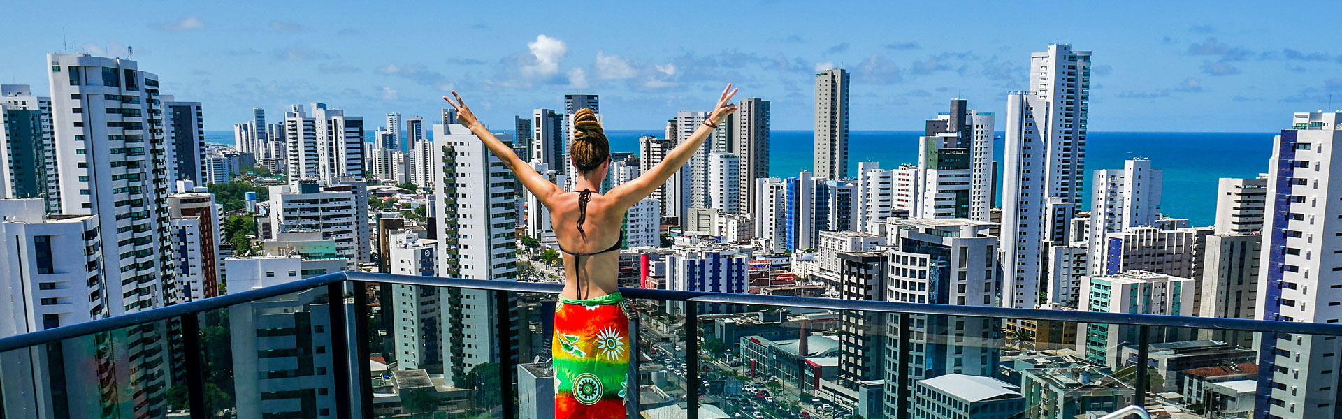 Rasta girl overlooking Boa Viagem and ocean in Recife, Brazil