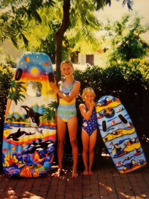 Old picture of sisters with their colorful floating mattresses