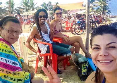 Rasta couple with Couchsurfing hosts at beach in Peruíbe, Brazil