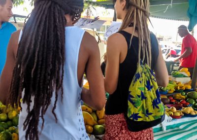 Rasta couple shopping at local fruit market in Peruíbe, Brazil