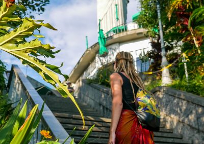Rasta girl climbing stairs to Christ the Redeemer in Rio de Janeiro, Brazil
