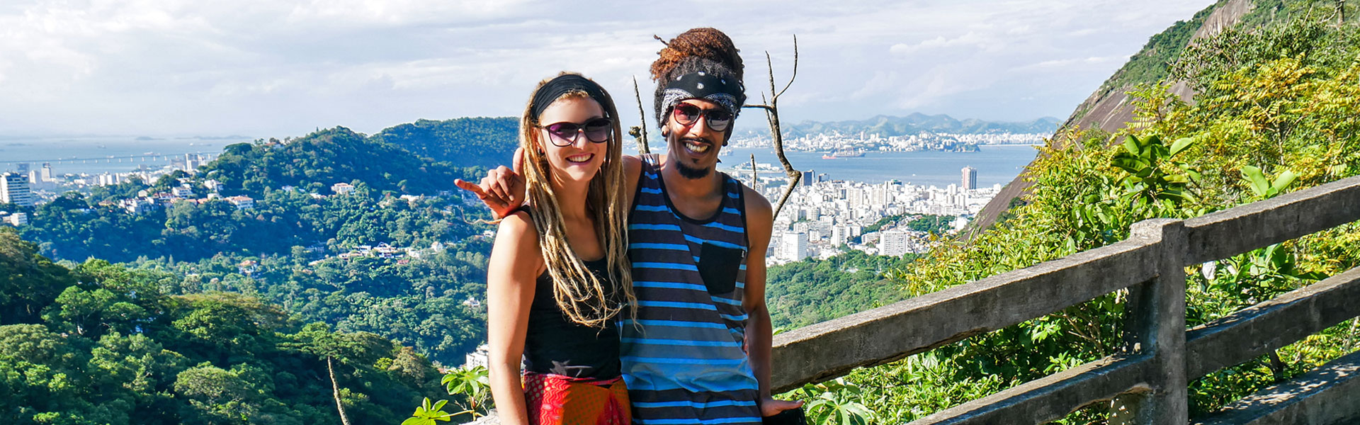 Rasta couple on Corcovado mountain in Tijuca Forest National Park overlooking Rio de Janeiro, Brazil