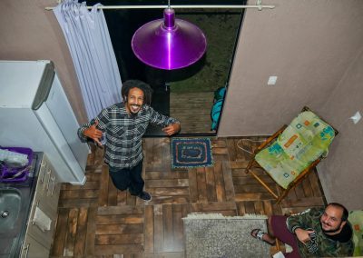 Rasta man with friend in house in Imbituba, Brazil