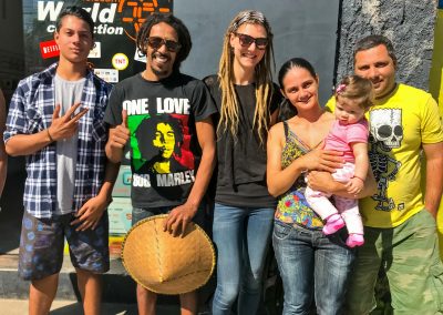 Rasta couple with local family in Peruíbe, Brazil