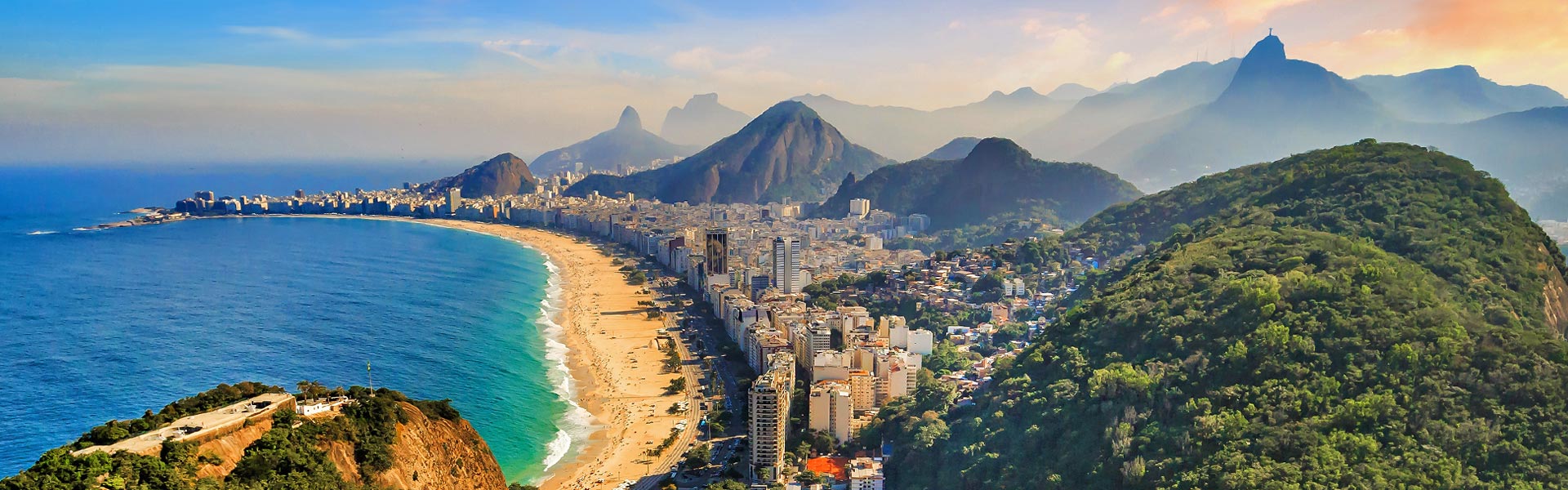 Aerial view of Copacabana with ocean, beach, mountains and buildings in Rio de Janeiro, Brazil