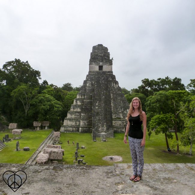 Girl in front of Mayan pyramid in Tikal, Guatemala